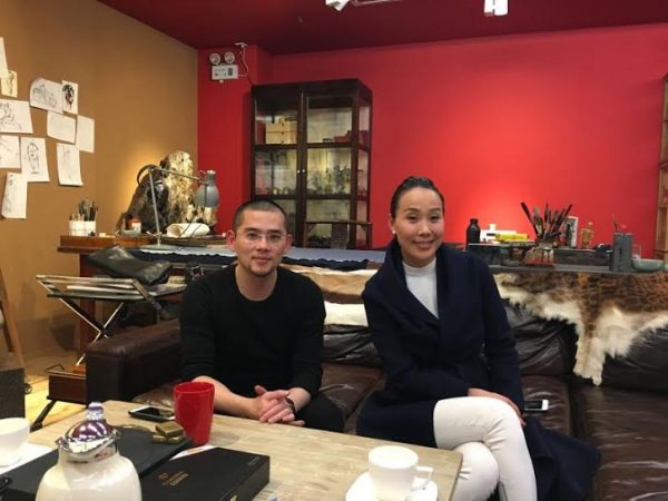 Ms. Susanna Yang with established sculptor Ren Zhe in his studio